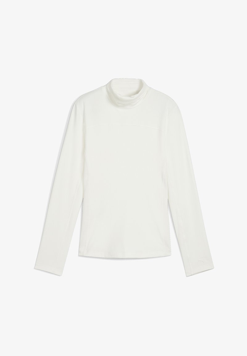 Balta garām piedurknēm turtleneck blūze, kas izgatavota no gludas auduma, ar pieguļošu formu, minimālām šuvēm un izliekta apkakli.