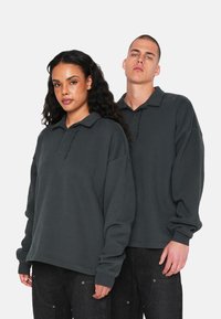 Poloshirts - schwarz
