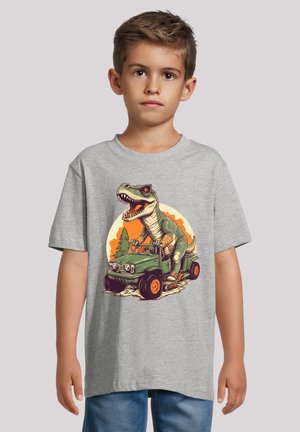 Gray cotton t-shirt featuring a colorful dinosaur graphic riding an army green jeep, with orange accents and a sunset background.