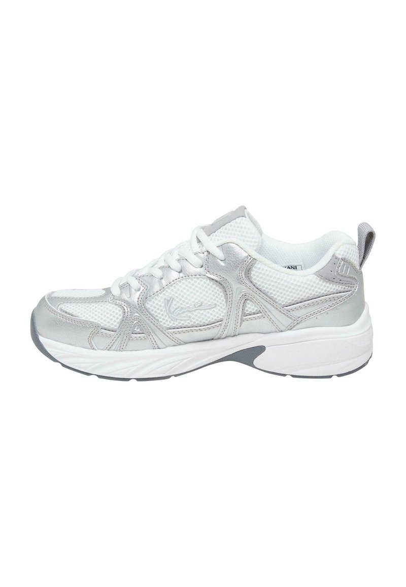 White athletic shoe with silver accents, mesh upper, padded tongue, and flexible rubber sole. Features laces and a small pull tab on the heel.