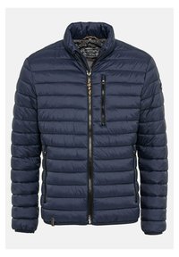 Marine blauwe pufferjack met een gewatteerd ontwerp, staande kraag, twee ritssluitingen aan de zijkanten en een verticale ritssluiting op de borst.