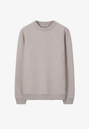Lichtbeige sweatshirt met lange mouwen en een ronde hals, met geribbelde manchetten en zoom, kleine stoffen label aan de voorkant links bij de onderzoom.