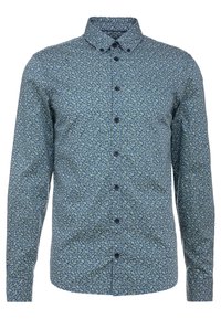 Camisa de hombre de manga larga con botones, en color azul marino y con un pequeño estampado floral en verde claro, y cuello abotonado.