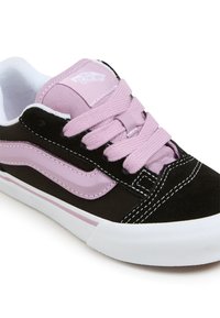 Black and pink sneakers featuring a suede and canvas upper, prominent laces, signature logo, and white rubber sole with pink accents.