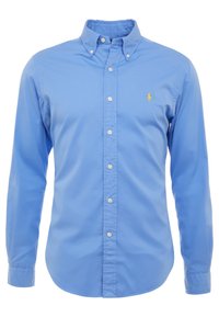 Světle modrá košile s límečkem, vyrobená z bavlny, s dlouhými rukávy a malým vyšívaným logem na hrudi.