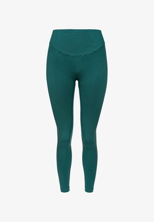 Mėlynos legginsai su aukštu liemeniu, pagaminti iš tamprios medžiagos. Yra be siūlių siuvimo ir turi glotnią, matinę tekstūrą.