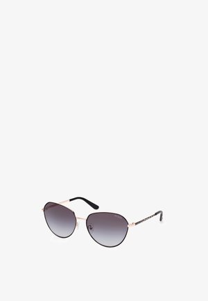 Aviator-solbriller med gradient grå linser, tynde guld metalrammer og sorte strukturerede tempelarme med det trykte varemærke.