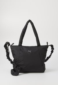 Zwarte nylon schoudertas met een gewatteerd ontwerp, twee schouderbanden en gerimpelde details. Heeft een klein zilveren Puma-logo aan de voorkant.