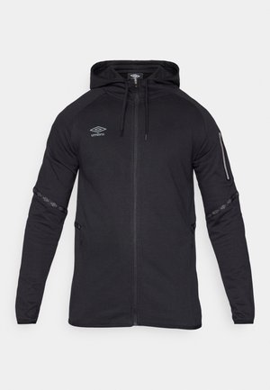 Sweatshirt preto com fecho éclair, capuz ajustável, mangas compridas, bolsos laterais e detalhes decorativos em padrões nas mangas. Feito de um tecido macio e elástico.