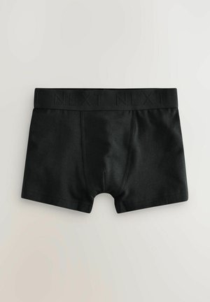 Fekete pamut boxer alsónadrág széles fekete derékpánttal, rajta bemélyített "NEXT" logóval, puha textúrával és alakformáló dizájnnal.