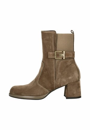 Brown suede ankle boot with a block heel, elastic side panel, and a decorative buckle. Smooth texture and rounded toe design.