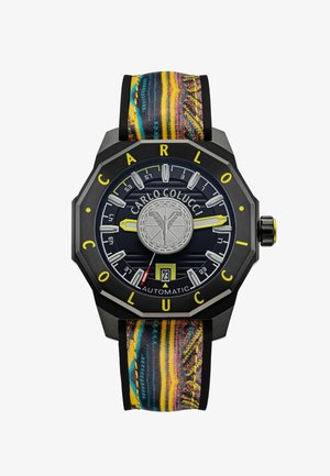 Automatic watch with a black octagonal case, blue textured dial, yellow accents, and a colorful patterned fabric strap. Features a date display.