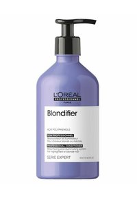 Purple plastic bottle with a black pump top. Label displays "L'Oréal Professionnel Blondifier" and details about professional conditioner. 500 ml.