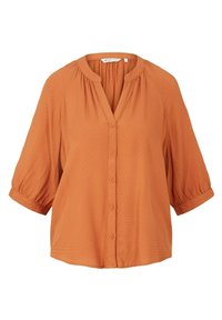 Rustfarbene Bluse mit V-Ausschnitt, Knopfleiste und kurzen Puffärmeln. Strukturierter Stoff mit einem dezenten Muster überall.