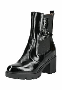 Bottine en cuir verni noir avec un talon épais, des panneaux latéraux élastiques et un détail de boucle décorative. Texture lisse et design de bout rond.