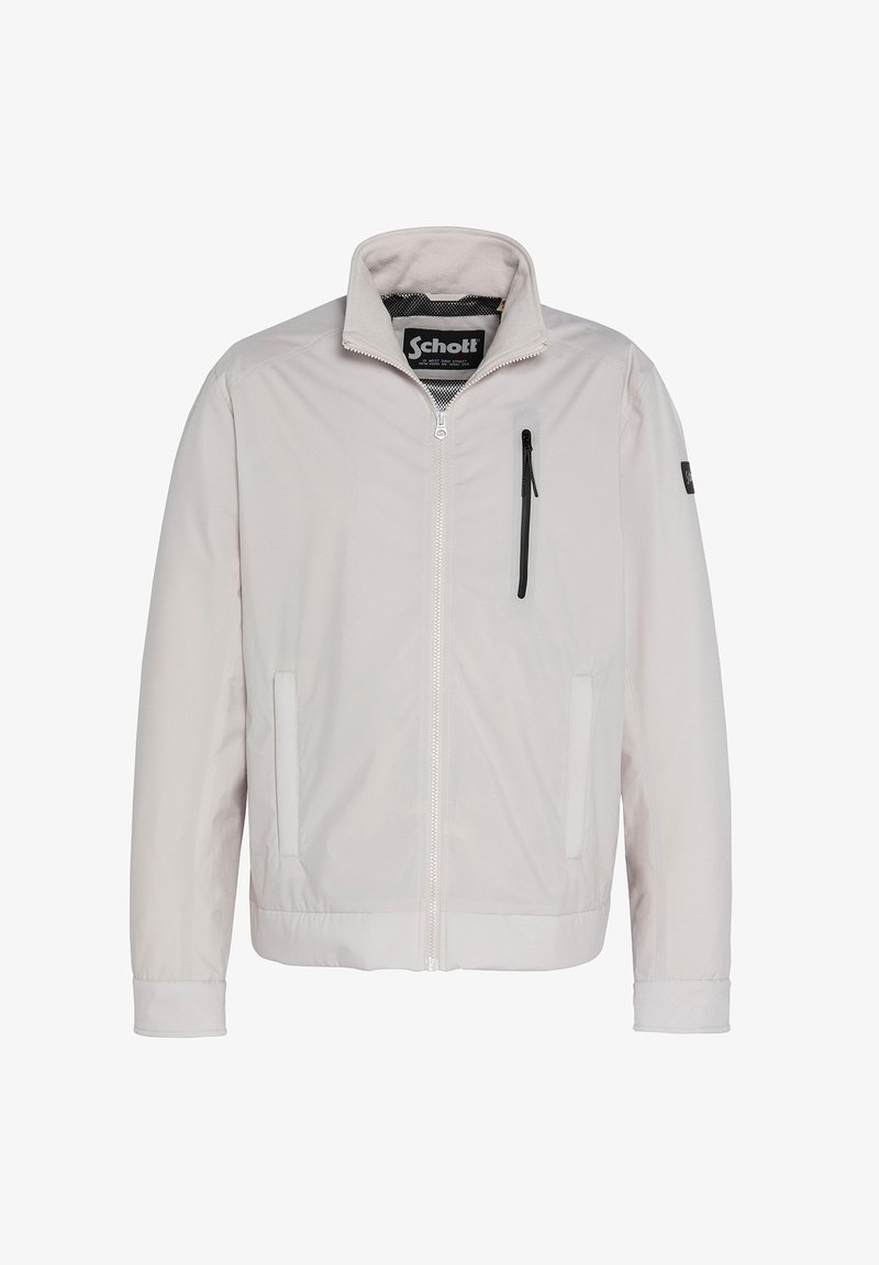 Lichtgrijze jas met een rits aan de voorkant, opstaande kraag, twee zijzakken en een ritszak op de borst. Soepele, lichte stof met een matte afwerking.