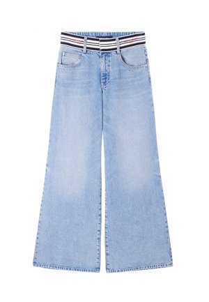Light blue wide-leg jeans with a black and white striped elastic waistband, featuring front pockets and a classic denim texture.