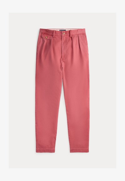 Roze katoenen broek met een ontspannen pasvorm, voorzien van voorplooien, zijzakken en een knoopsluiting. Soepele textuur, rechte pijp.
