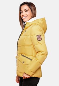 Yellow puffer jacket with a textured finish, featuring a fur-lined hood, two zippered pockets, and a logo patch on the left sleeve.