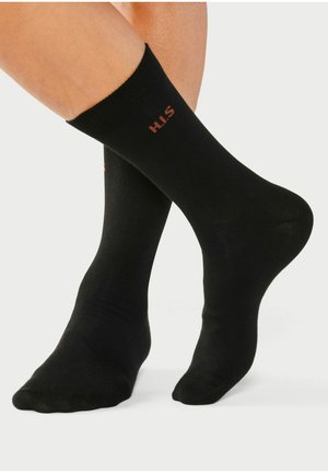 Schwarze Socken aus einem glatten, dehnbaren Material, mit einem gerippten Bund und rotem "H.I.S."-Logo an der Seite.