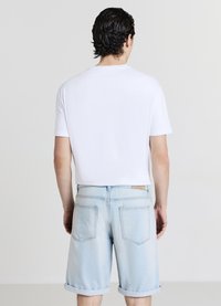 Calliope SLAVATO - Shorts di jeans - blu denim slavato