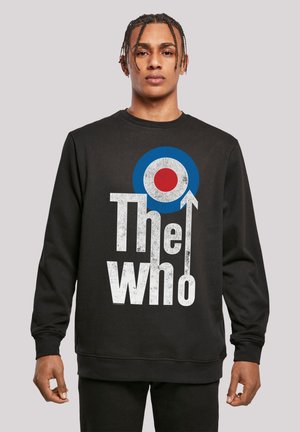 Black sweatshirt featuring a large graphic of a blue and red target symbol and text reading “The Who” in distressed white lettering.