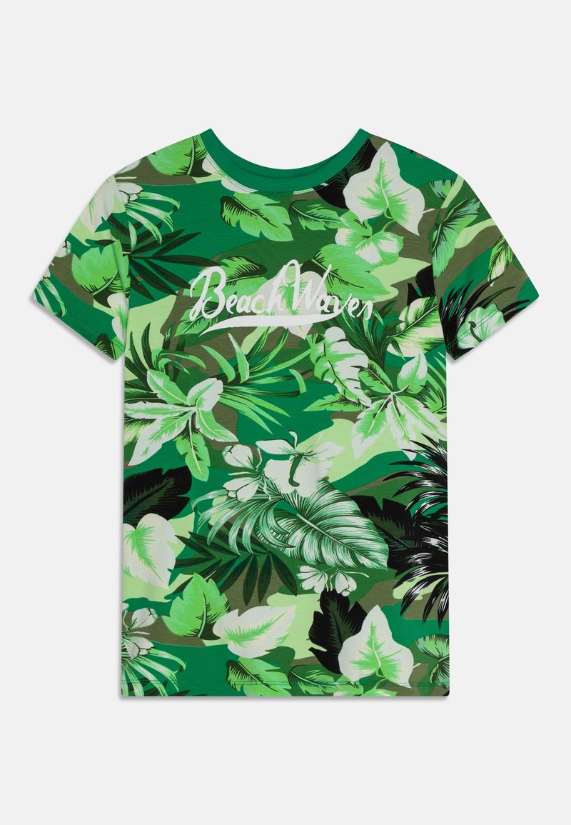 T-shirt vert à manches courtes avec motifs de feuilles tropicales et texte blanc "Beach Waves" sur la poitrine.