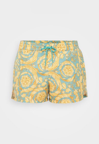 Shorts de bain avec une base bleu clair, ornés de motifs floraux et de vignes jaunes vives. Taille élastique avec cordon de serrage pour un ajustement.