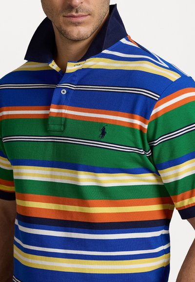 Striped polo shirt featuring vibrant colors: blue, green, orange, yellow, and white. Includes a dark navy collar and a small logo detail.
