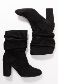 Unisa Stivaletti - black