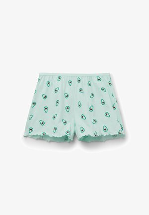 Hellgrüne Shorts mit kleinen Avocado-Mustern und wellenförmigen Säumen, flach auf weißem Hintergrund liegend.