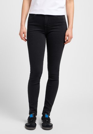 Jean skinny noirs en denim à la texture lisse, avec un design classique à cinq poches et une légère élasticité pour le confort.