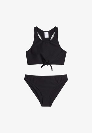 Set bikini nero con top cropped testurizzato e dettaglio con nodo frontale, abbinato a slip a vita bassa. Design semplice a tinta unita.