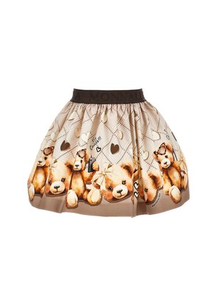 Jupe marron avec un motif de teddy bear ludique, dotée d'une taille texturée, de motifs en forme de cœur et d'un design plissé. Texture de tissu lisse.