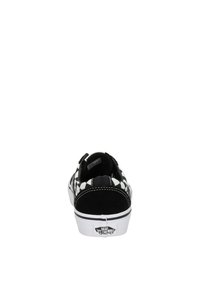 Scarpa slip-on in tela a scacchi bianco e nero con dettagli in suede sul tallone e suola in gomma bianca, featuring il logo Vans sul retro.