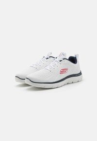 White athletic shoes with mesh upper, textured design, navy accents, and red logo; lightweight sole with a thick, cushioned profile.