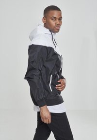 Urban Classics ARROW WINDRUNNER - Poletna jakna - red/blk