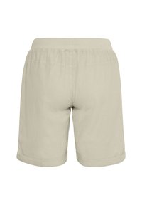 Pantalones cortos de algodón beiges con una cintura elástica, dobles en los bajos y una textura suave, mostrados desde la parte de atrás. Diseño simple y casual.