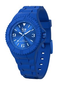 Reloj de goma azul con esfera redonda, marcadores de hora blancos y bisel giratorio. Presenta una correa texturizada y resistencia al agua de hasta 10 ATM.