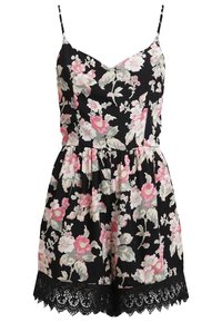 Svart blommig jumpsuit med rosa och grå blommor, tunna axelremmar, samlad midja och blondering vid fållen. Lättviktigt tyg.
