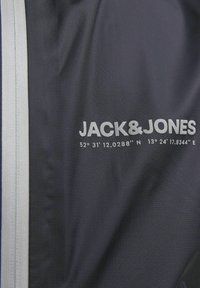 Jack & Jones Kids Αδιάβροχο μπουφάν - black
