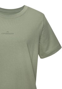 Short-sleeve, crew-neck t-shirt in light green cotton. Features small "COPENHAGEN" logo in dark gray and smooth texture.