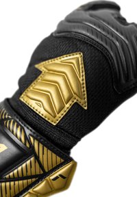Black glove with textured gold and black accents, featuring a prominent golden chevron design and gripping patterns.