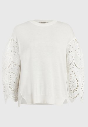 Sweater blanc à manches longues avec broderie florale en dentelle sur des manches bouffantes, un col rond côtelé et un ourlet.
