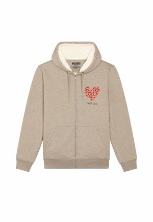 Beige zip-up hoodie met een zachte, pluizige binnenkant, met een rode hartafbeelding en de tekst "SWEET" eronder. Inclusief twee zijzakken.