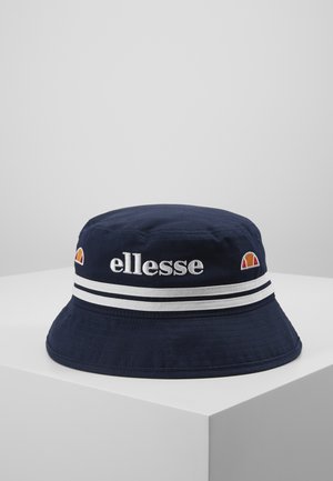 Navy bucket hat with white striped accents, embroidered "ellesse" logo, and a small color-blocked logo. Made of lightweight fabric.