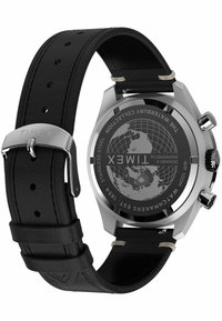 Black leather watch strap with silver stainless steel case. Round face features world map design. Notable engraved details on back.