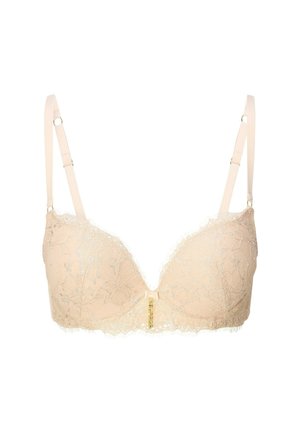 Soutien-gorge en dentelle de couleur nude avec un décolleté plongeant, des bretelles ajustables et un fermoir décoratif à l'avant avec des accents dorés.
