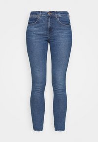 Vaqueros ajustados de mezclilla azul oscuro. Presentan una cintura alta, diseño de cinco bolsillos y detalles de costura sutil a lo largo de las costuras.