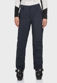 Navy wasserdichte Skihosen aus strapazierfähigem Material, mit geradem Schnitt, Reißverschlusstaschen und Knopfschluss. Strukturiert Oberfläche.